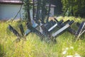 Close up of abandoned anti tank barrier in a savaged flower field Royalty Free Stock Photo