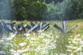 Close up of abandoned anti tank barrier in a savaged flower field Royalty Free Stock Photo