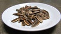 Close Up from above of Sunflower Seeds on a White Plate.