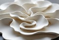 Delicate white ceramic sculpture with flowing, organic shapes and smooth Royalty Free Stock Photo
