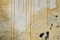 Close-up abstract drawing on the wall of a building with yellow black paint Royalty Free Stock Photo