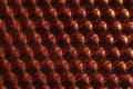 A close up abstract macro photo of a plastic orange reflector