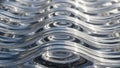 Close-up abstract metallic wavy lines with reflections creating a futuristic and sleek textured surface pattern Royalty Free Stock Photo