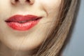 Close up abstract portrait of a beautiful caucasian girl with red lipstick. Windy hair blowing on face Royalty Free Stock Photo