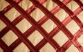 Close up Abstract of silk or satin fabric background of linen cloth textile of red fabric with crisscross diagonal pattern for any Royalty Free Stock Photo