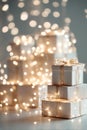 A close-up of abstract, soft focus fairy lights gently illuminating a stack of generic gift boxes, creating a dreamy scene Royalty Free Stock Photo