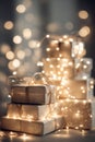 A close-up of abstract, soft focus fairy lights gently illuminating a stack of generic gift boxes, creating a dreamy scene Royalty Free Stock Photo