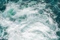 Close-up abstract texture above view of river torrent and clear fresh cold water flowing through mountain rocks in Royalty Free Stock Photo