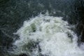 Close-up abstract texture above view of river torrent and clear fresh cold water flowing through mountain rocks in valley with Royalty Free Stock Photo