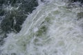 Close-up abstract texture above view of river torrent and clear fresh cold water flowing through mountain rocks in valley with Royalty Free Stock Photo