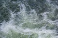 Close-up abstract texture above view of river torrent and clear fresh cold water flowing through mountain rocks in valley with Royalty Free Stock Photo