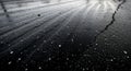 Close-up of Cracked Asphalt Surface with Water Puddles and White Specks road texture Royalty Free Stock Photo