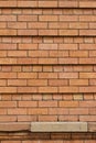 Close up abstract view of orange red brick wall texture with recessed brickwork Royalty Free Stock Photo