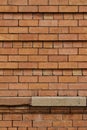 Close up abstract view of orange red brick wall texture with recessed brickwork Royalty Free Stock Photo