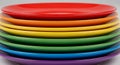 Stack of rainbow colored plates Royalty Free Stock Photo
