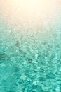 Close up abstract water texture. Turquoise swimming pool water background. Copy space, top view. Sun light effect and Royalty Free Stock Photo