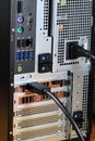 Close up of AC power and display port cable plugged into the back of desktop PC or workstation Royalty Free Stock Photo