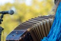 Close up of accordion and accordion player playing at Klezmer concert of Jewish music in Regent`s Park in London Royalty Free Stock Photo