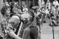 Accordionist Busking with a Band on a Street in York.