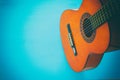 Close up of acoustic guitar against a wooden background Royalty Free Stock Photo