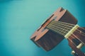 Close up of acoustic guitar against a wooden background Royalty Free Stock Photo