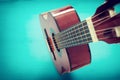 Close up of acoustic guitar against a wooden background Royalty Free Stock Photo