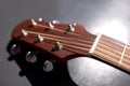 close up of acoustic guitar head with pegs Royalty Free Stock Photo