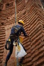 A close-up of an Acrobatica operator executing the final stage of wall setup prior to the artistic performance in Alba, Italy, Royalty Free Stock Photo