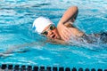 Close up action shot of teen swimmer. Royalty Free Stock Photo