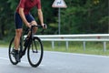 Close up of active man biking on paved road