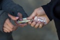 Close up of addict buying dose from drug dealer Royalty Free Stock Photo