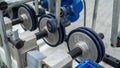 Close-up of adjustable rubber rollers on industrial conveyor processing machine Royalty Free Stock Photo
