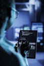 Data center manager codes on tablet Royalty Free Stock Photo