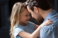 Close up adorable little daughter and father touching foreheads Royalty Free Stock Photo