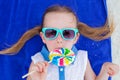 Close up adorable little girl with lollipop on Royalty Free Stock Photo