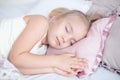 Close-up Adorable little girl sleep in the bed with closed eyes Royalty Free Stock Photo