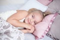 Close-up Adorable little girl sleep in the bed with open eyes Royalty Free Stock Photo