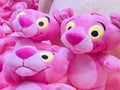 A close-up of adorable Pink Panther plush dolls.