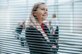 Close up. adult businesswoman standing in front of the office window. Royalty Free Stock Photo