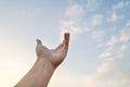 Adult hand reaching out towards the sky Royalty Free Stock Photo