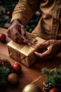 Close-up adult person hands wrapping a Christmas gift