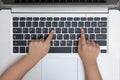 Close up aerial view of children hands typing on laptop Royalty Free Stock Photo