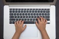 Close up aerial view of children hands typing on laptop Royalty Free Stock Photo
