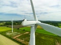 Close up aerial view of a wind turbine in a small rural wind farm in the English countryside Royalty Free Stock Photo