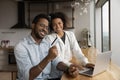 Close up African American couple paying online by credit card Royalty Free Stock Photo
