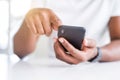 Close up of african american man hands using smartphone Royalty Free Stock Photo