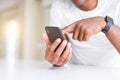 Close up of african american man hands using smartphone Royalty Free Stock Photo