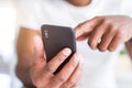 Close up of african american man hands using smartphone Royalty Free Stock Photo