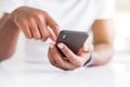 Close up of african american man hands using smartphone Royalty Free Stock Photo