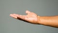 Close up of African American man`s hand against a solid background Royalty Free Stock Photo